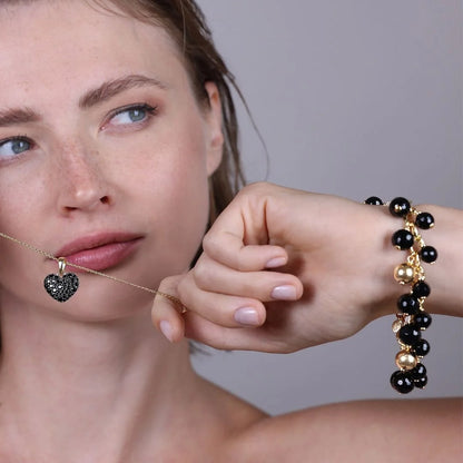 Bracciale con Charm in Onice Nero Sfaccettato e Bead Lucide in Argento 925 placcato Oro Giallo 18Kt